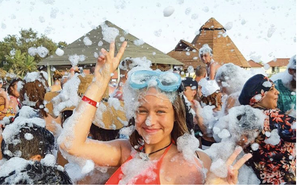 Teen with goggles in foam - Mike's Foam Parties foam party rentals Chillicothe, IL